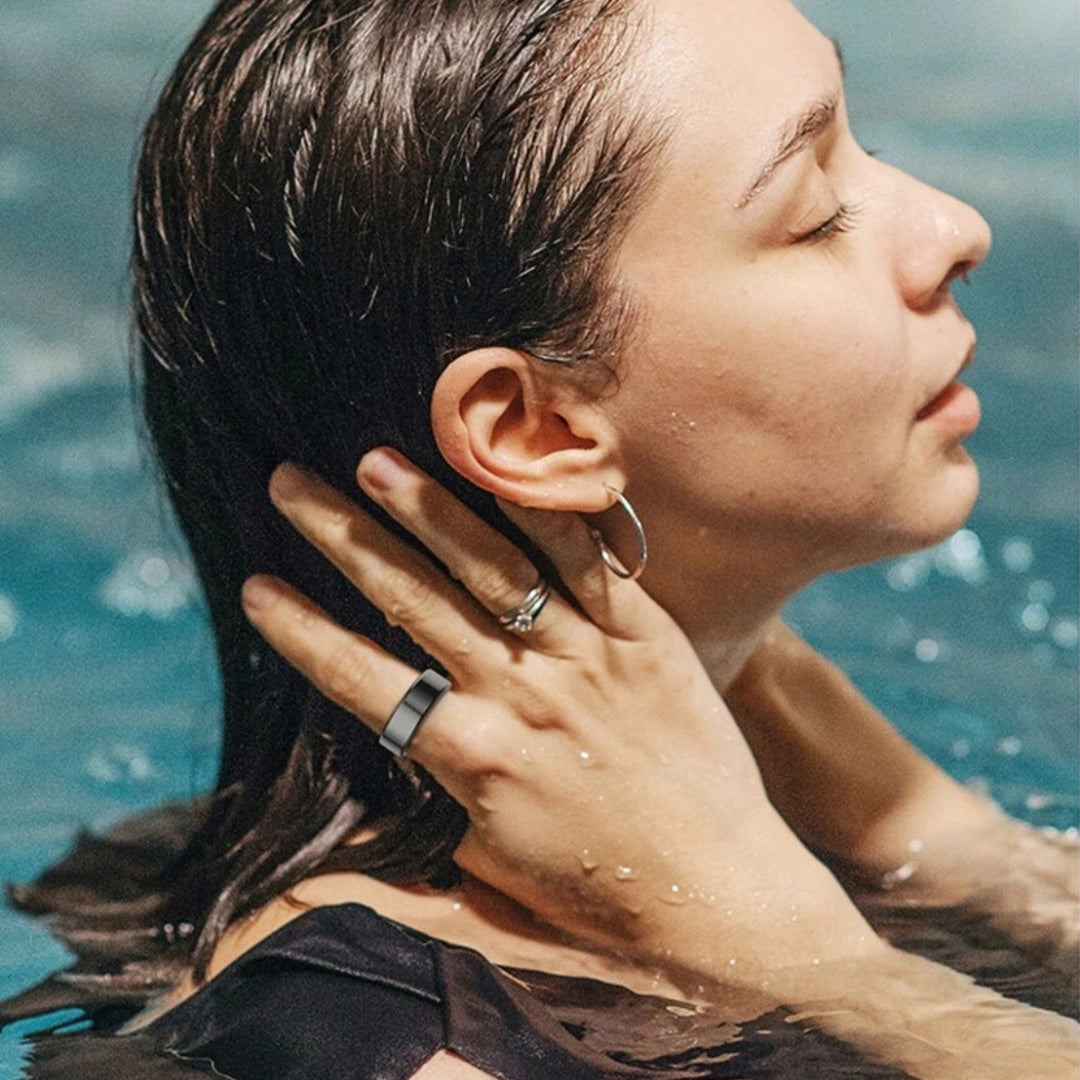 a woman in the water wearing R1 Smart Ring