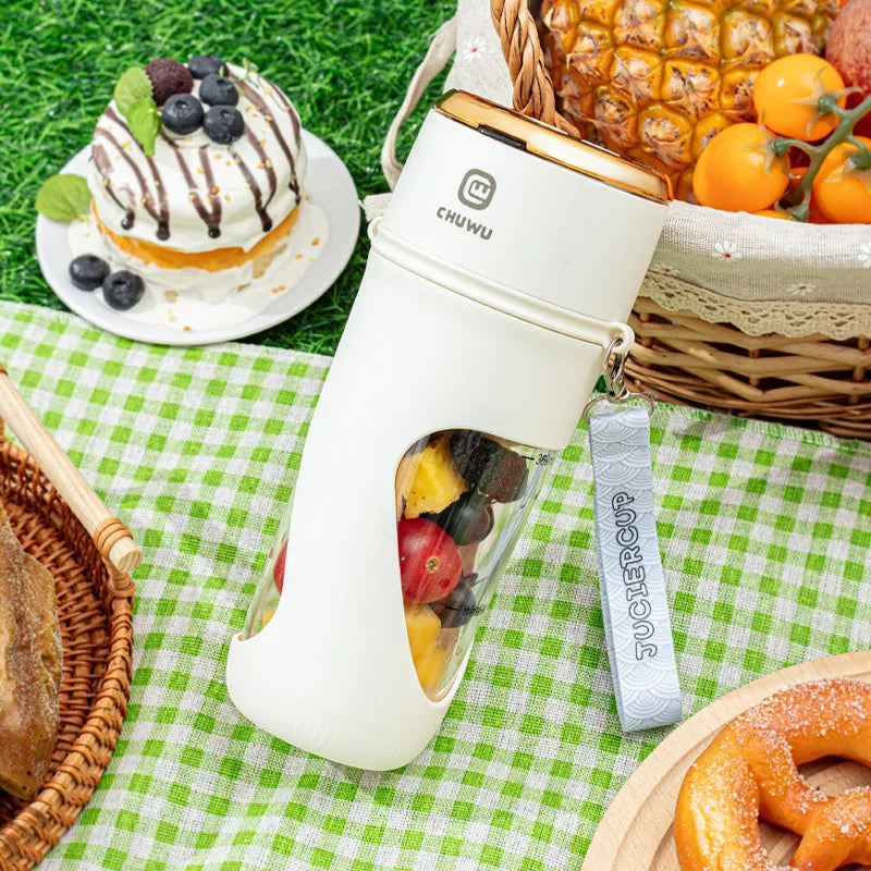 a table topped with plates of food and portable blender